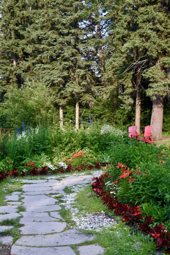 vecteezy a path in a park leads to two red chairs 7251333